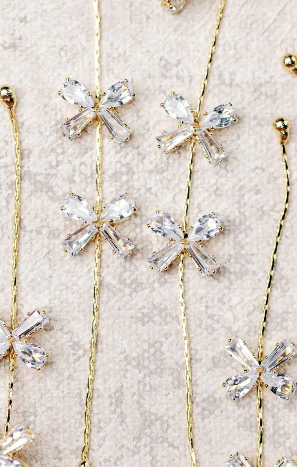 Diamond Bow Gold Duster Drop Holiday Earrings